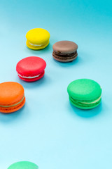 Close-up shot of colored macaroons in different position