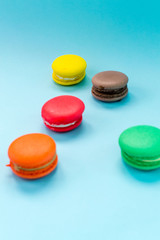 Close-up shot of colored macaroons in different position