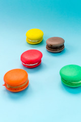 Close-up shot of colored macaroons in different position