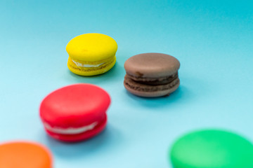 Close-up shot of colored macaroons in different position
