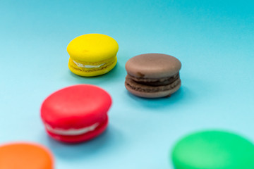 Obraz na płótnie Canvas Close-up shot of colored macaroons in different position