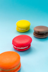 Close-up shot of colored macaroons in different position