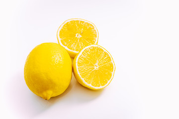 lemon cut in two with a white background