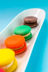 Close-up shot of colored macaroons in different position