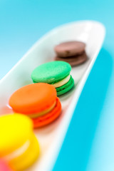 Close-up shot of colored macaroons in different position