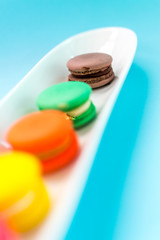 Close-up shot of colored macaroons in different position