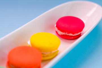 Close-up shot of colored macaroons in different position