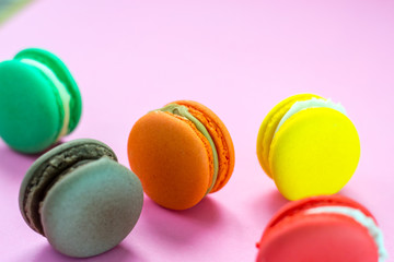 Close-up shot of colored macaroons in different position