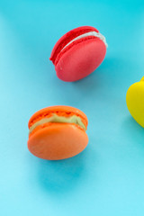 Close-up shot of colored macaroons in different position