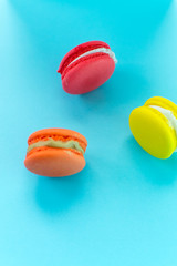 Close-up shot of colored macaroons in different position