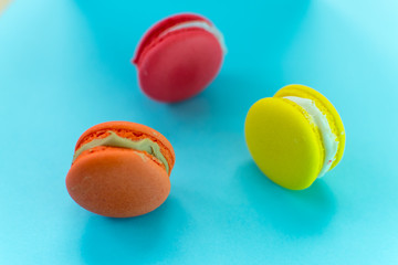 Close-up shot of colored macaroons in different position