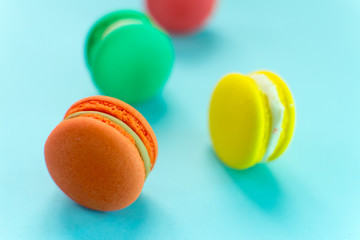 Close-up shot of colored macaroons in different position