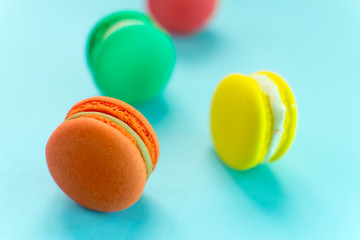 Close-up shot of colored macaroons in different position
