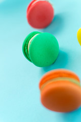 Close-up shot of colored macaroons in different position