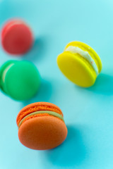 Close-up shot of colored macaroons in different position