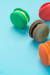 Close-up shot of colored macaroons in different position