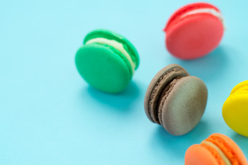 Close-up shot of colored macaroons in different position