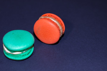 Close-up shot of colored macaroons in different position