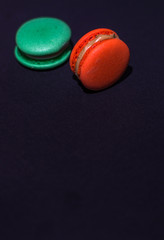 Close-up shot of colored macaroons in different position
