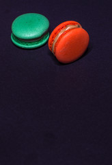 Close-up shot of colored macaroons in different position