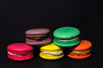Close-up shot of colored macaroons in different position