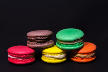 Close-up shot of colored macaroons in different position