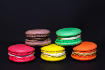 Close-up shot of colored macaroons in different position