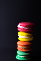 Close-up shot of colored macaroons in different position