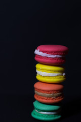 Close-up shot of colored macaroons in different position