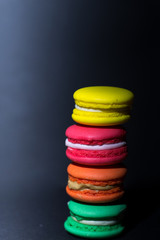 Close-up shot of colored macaroons in different position