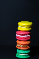 Close-up shot of colored macaroons in different position