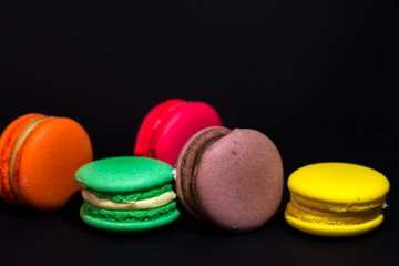 Close-up shot of colored macaroons in different position
