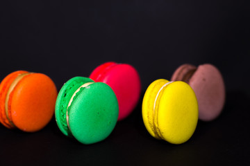 Fototapeta na wymiar Close-up shot of colored macaroons in different position