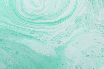 photography of abstract marbleized effect background. mint, green and white creative colors. Beautiful paint. banner