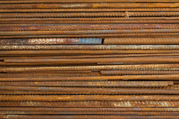 Top view stack of straight old rusty high yield stress deformed reinforcement steel or iron bars....
