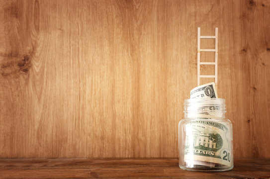 Business image of savings jar and ladder, money investment and financial growth concept