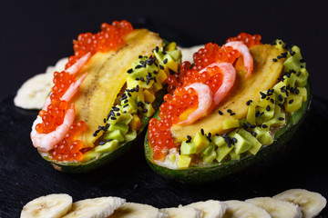 Avocado with banana caviar shrimp and canned tuna
