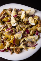 Salad with eggs onion potatoes and sause