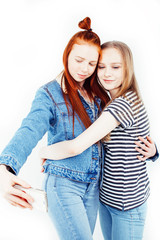 two best friends teenage girls together having fun, posing emotional on white background, besties happy smiling, making selfie, lifestyle people concept