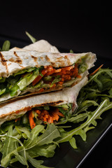 Vegetarian delicious pita with arugula and carrots