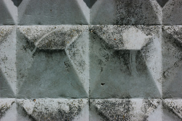 Old dirty soviet concrete fencing with cracked surface close-up.