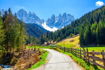 Alpine road with a beautiful view in Santa Maddalena village, Dolomites, Italy.