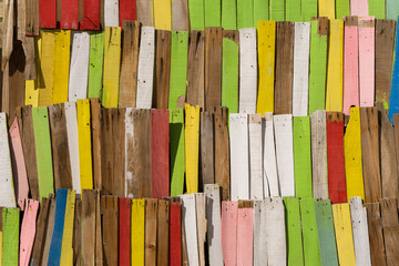 close up of a wall made of colorful wooden batten