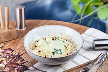 Close up view on Chicken Meatballs in cream sauce with cheese parmesan in bowl. Healthy, dieting, balanced food for lunch. Wooden background. Copy space for design. Horizontal
