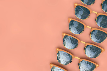 Summer sunglasses with tropical palm tree reflections. 3D Rendering