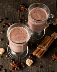 Chocolate, coffee, milk, banana shake on wooden background. Smoothie with cookies. Milkshake. Protein diet. Healthy food concept.