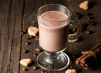 Chocolate, coffee, milk, banana shake on wooden background. Smoothie with cookies. Milkshake. Protein diet. Healthy food concept.