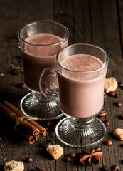 Chocolate, coffee, milk, banana shake on wooden background. Smoothie with cookies. Milkshake. Protein diet. Healthy food concept.