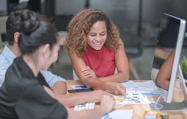 Young creative business colleagues brainstorming discussing new startup project in office