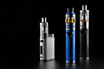 electronic cigarettes or vaping devices on black background